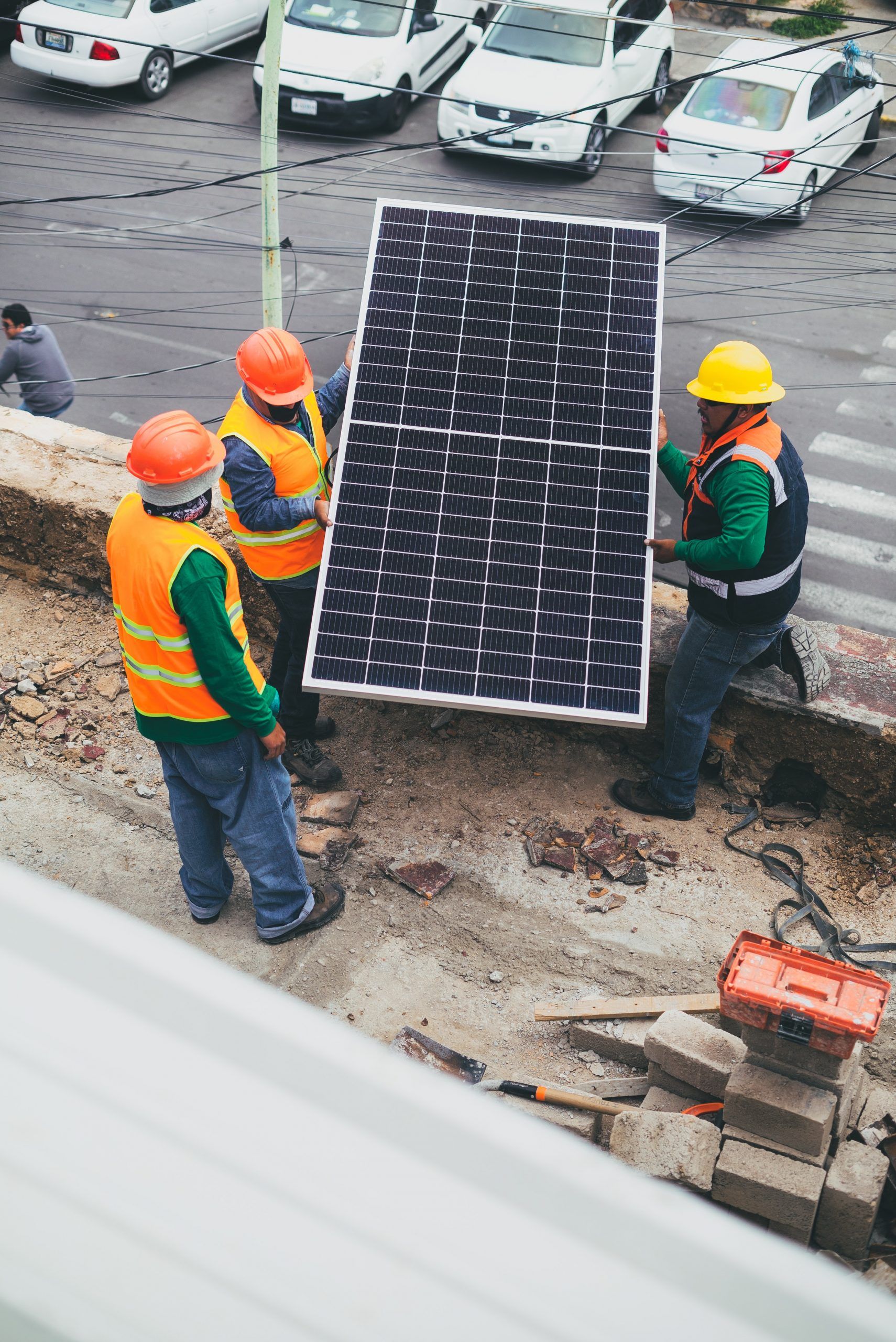 construction workers installing a solar panel